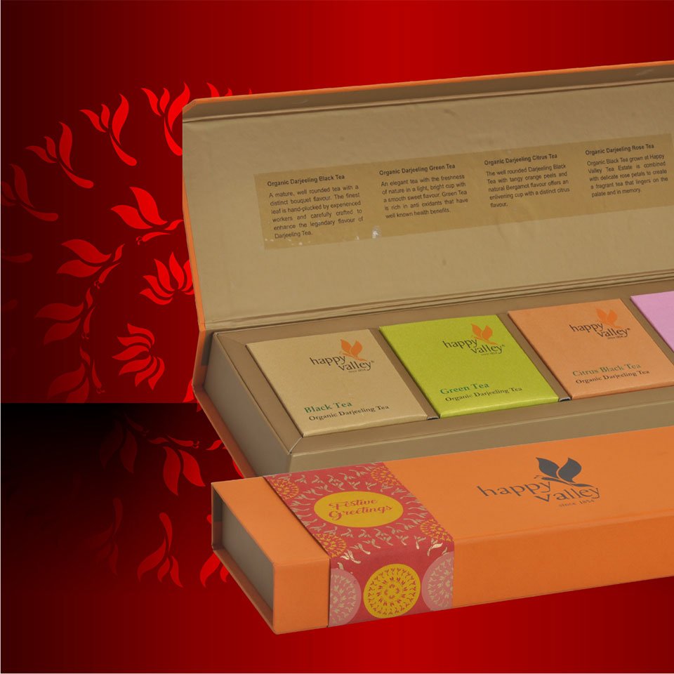 https://www.old.wysiwyg.co.in/sites/default/files/worksThumb/Ambootia-happy-valley-tea-packaging-box-festive-durga-puja-2017.jpg